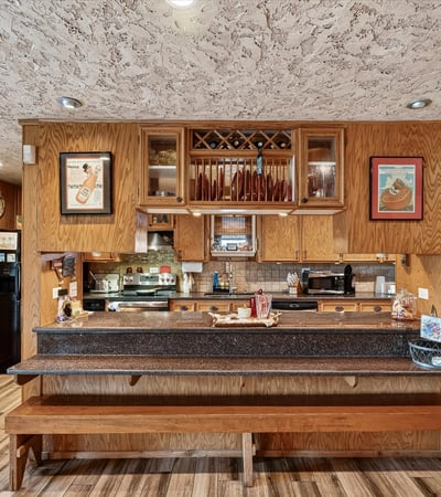This inviting kitchen features ample counter space and a unique design, perfect for gatherings and culinary creativity.
