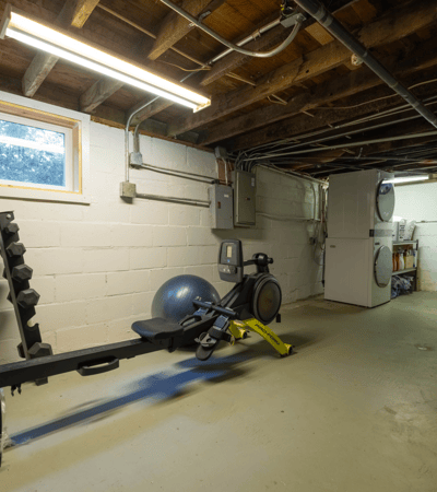 Spacious basement equipped for fitness, featuring ample room for equipment and storage options.