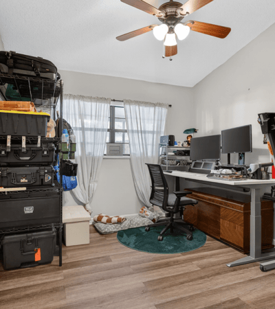 This versatile room offers ample storage, ideal for a home office or creative space.