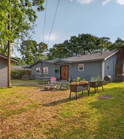 Discover a spacious backyard perfect for gatherings, featuring ample space and unique landscaping opportunities.