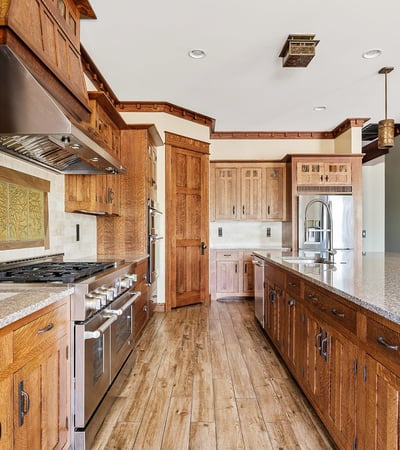 Gourmet kitchen equipped with professional appliances, custom cabinetry, and expansive prep space. Designed for culinary enthusiasts, this Phoenix home offers elevated finishes and everyday practicality.