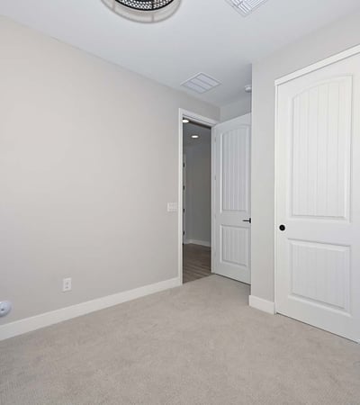 Featuring soft carpet and a large closet, this third bedroom is a blank canvas ready for personalization or practical use.