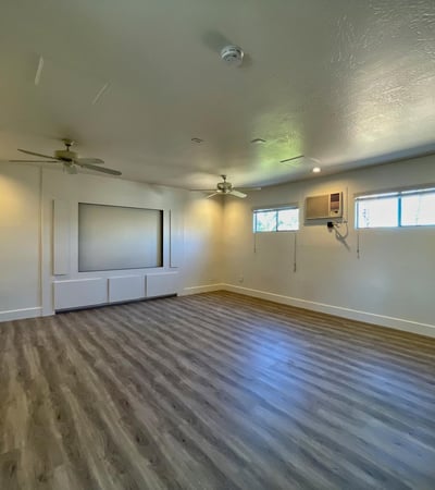 Expansive upstairs room ideal for media, office, or fitness space. Recessed lighting and clean finishes enhance its versatility.
