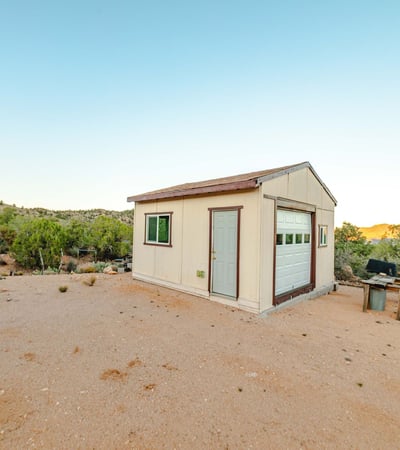 Set against acres of open land, this detached shed is perfect for workshop needs, storage, or equipment use. Its placement offers privacy and sweeping Hackberry views.
