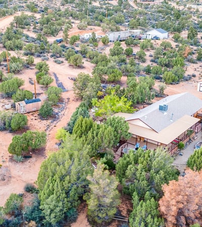 This sweeping shot captures the vast desert landscape and dramatic mountain ridge. The perfect visual representation of the tranquility and beauty surrounding this Hackberry property.