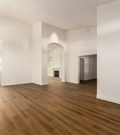 Dramatic vaulted ceilings and clean modern finishes highlight this spacious Scottsdale living area. The open design and large windows create a bright environment ideal for relaxing or entertaining.