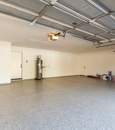 Expansive three-car garage offering plenty of room for vehicles, storage solutions, and workspace. The Scottsdale garage features a clean finished floor and direct access to the home for everyday convenience.