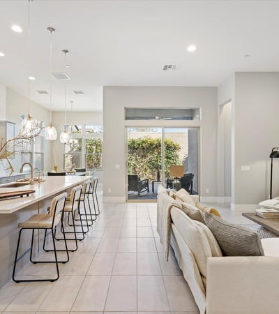 Stunning great room with tall ceilings, expansive windows, and open sightlines that enhance light, space, and livability throughout the home.