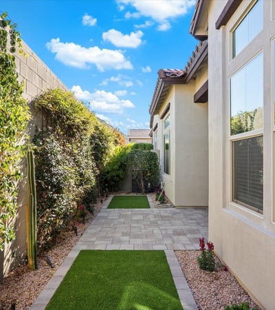 Private backyard featuring artificial turf and low-maintenance landscaping, providing a clean and functional outdoor space.