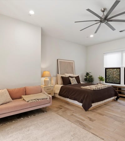 Bonus room featuring built-in shelving and open floor space, ideal for storage, hobbies, or relaxation. Designed for flexible Scottsdale living.