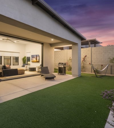 Covered patio paired with artificial turf creates an ideal outdoor living space. Designed for easy maintenance and entertaining in Scottsdale.