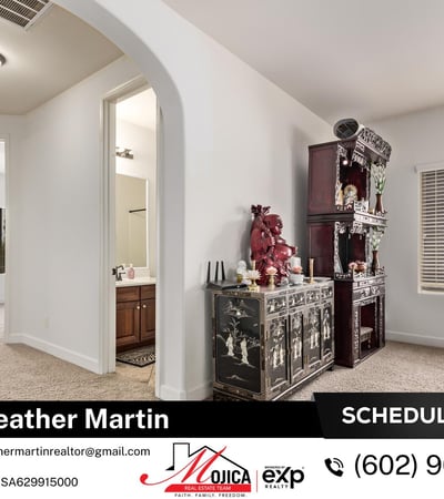 Filled with natural light, this loft area offers flexibility for modern living needs. Plush carpeting and open railing details contribute to the comfortable layout of this Glendale residence.