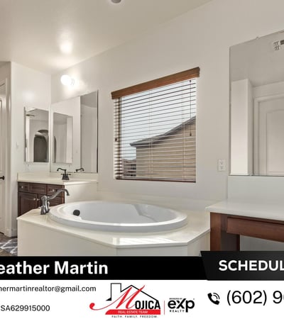 Featuring an extended vanity with dedicated makeup space and a large soaking tub, this primary bath blends style and functionality in this beautifully maintained Glendale home.
