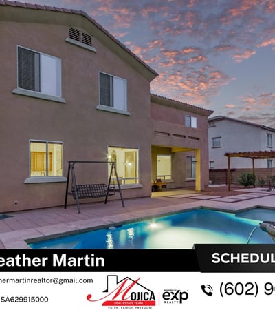 Evening lighting showcases the inviting covered patio and shimmering pool. Designed for entertaining, this Glendale home offers seamless indoor-outdoor flow and energy-efficient comfort.