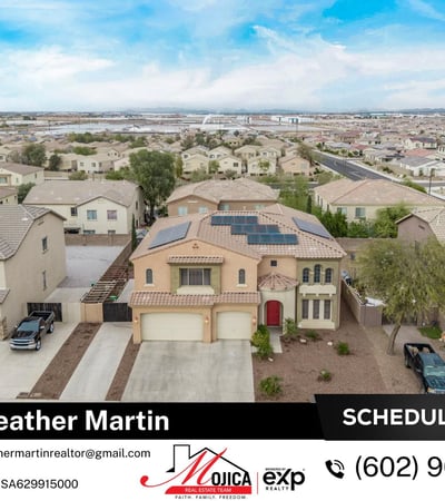 Drone perspective highlights the tile roof, 3-car garage, and solar energy system. This Glendale home offers impressive exterior design and energy-efficient features.