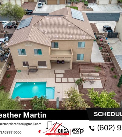 Drone view captures the pool, paver patio, and shaded pergola dining area. Solar energy features and organized outdoor layout enhance this Glendale property.