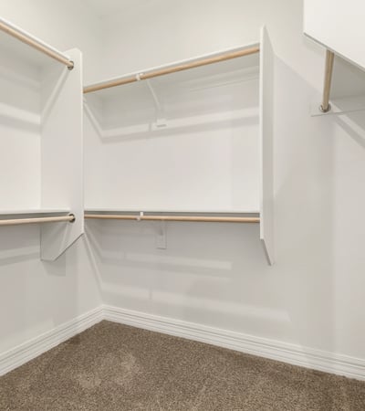 Large walk-in closet with built-in organization, ideal for maximizing storage and keeping everything neatly arranged.