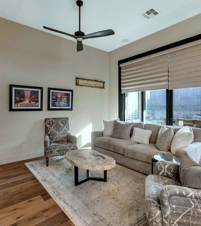 Living room with large sliding doors and natural light, offering easy access to outdoor living spaces in this Phoenix home.