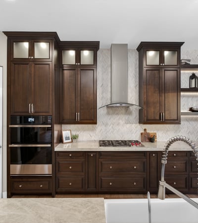 Custom kitchen with built-in oven, sleek cabinetry, and gas cooktop, offering both functionality and luxury in this Scottsdale property.