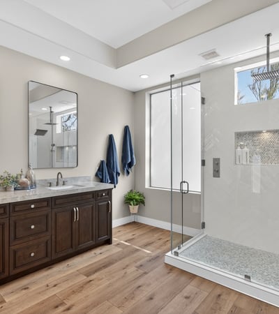 Contemporary Scottsdale bathroom with a large walk-in shower, rainfall fixture, and sleek tile finishes for a spa-like experience.