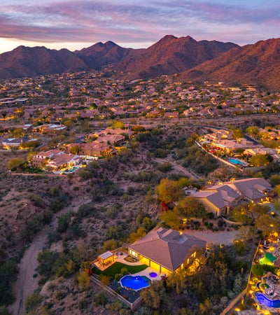 Scottsdale aerial showcasing natural desert terrain, nearby homes, and open space enhancing privacy and views.