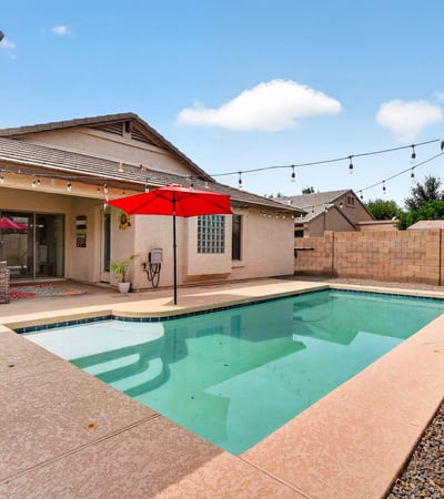 Backyard retreat with pool, patio, and easy-care landscaping. Ideal for relaxing or entertaining in this Casa Grande home.
