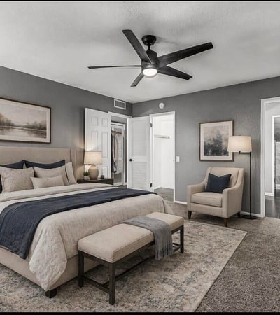 Beautifully staged bedroom emphasizing space, lighting, and modern finishes. This Sun City home showcases move-in ready interiors with contemporary updates.