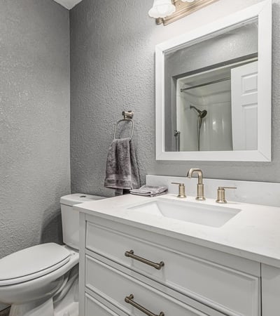 Updated bathroom with contemporary vanity, fixtures, and lighting. This Sun City home showcases refreshed interiors and stylish upgrades.