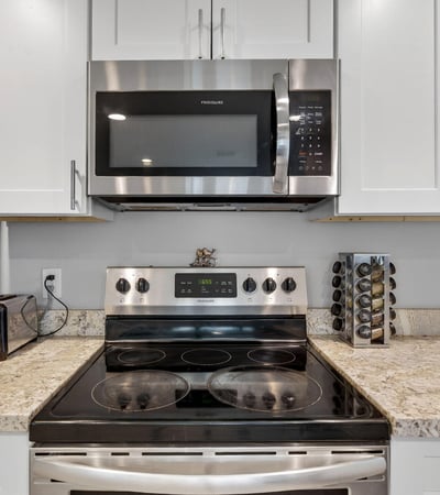 Stylish kitchen with stainless appliances, upgraded counters, and clean cabinetry, offering a move-in-ready cooking space.