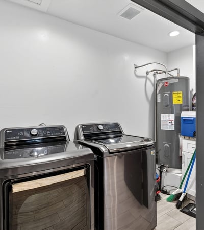 Convenient interior laundry space with appliances and storage, enhancing everyday functionality.