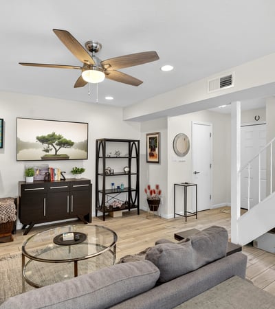 Spacious Scottsdale living room with updated flooring, recessed lighting, and flexible layout ideal for relaxing or hosting guests.