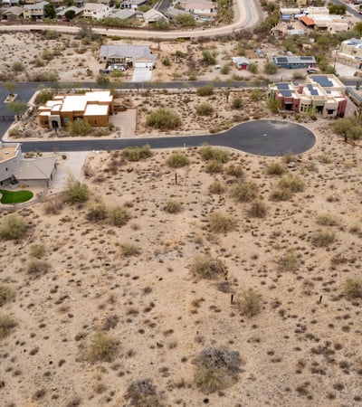 Peaceful hillside neighborhood surrounded by mountain landscapes and upscale custom homes. This elevated Phoenix homesite offers stunning views and a tranquil desert lifestyle.