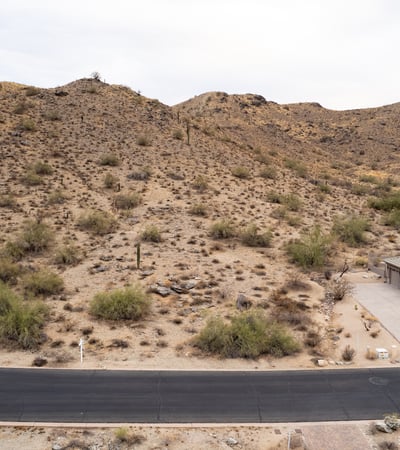 Elevated desert homesite with nearby hiking trail access and scenic mountain views. This Phoenix property combines natural desert beauty, privacy, and luxury custom home potential in a highly desirable hillside location.