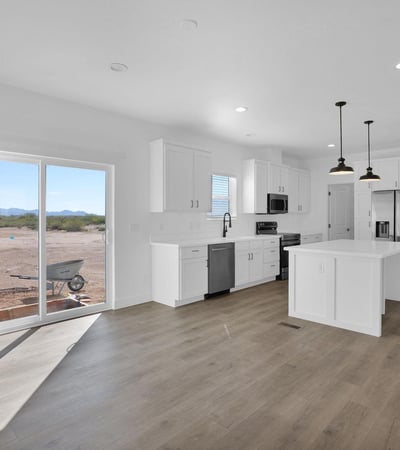 Open-concept living area designed for modern lifestyles with abundant natural light, durable flooring, and direct access to outdoor spaces. The spacious layout creates an inviting atmosphere for entertaining and daily living.