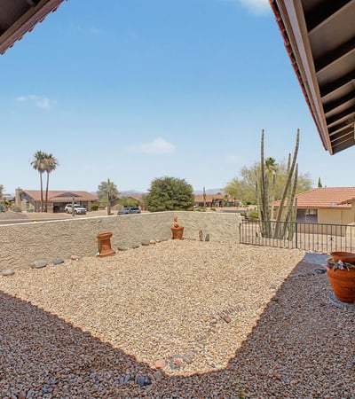 Relax and enjoy the beauty of Fountain Hills from this inviting front outdoor space. The combination of mountain views, desert landscaping, and privacy creates a peaceful environment to unwind.
