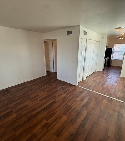Versatile living space featuring durable flooring, abundant wall space, and an open floor plan. Natural light and flexible room arrangements enhance the home's comfortable and inviting atmosphere.
