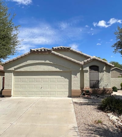 Well-maintained single-level home with a two-car garage, wide driveway, and mature landscaping that enhances curb appeal. The inviting exterior reflects the comfortable lifestyle and convenience offered in this sought-after Goodyear location.