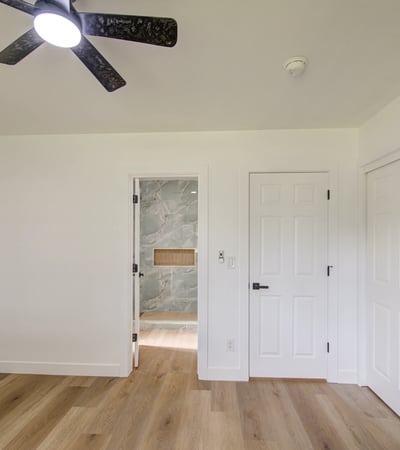 Bright windows, updated flooring, generous closet space, and contemporary finishes create a relaxing secondary bedroom that's ready for immediate enjoyment.