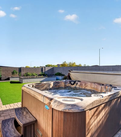 Relax in your own backyard spa surrounded by attractive pavers, lush artificial turf, raised planter beds, and thoughtfully designed outdoor gathering spaces.