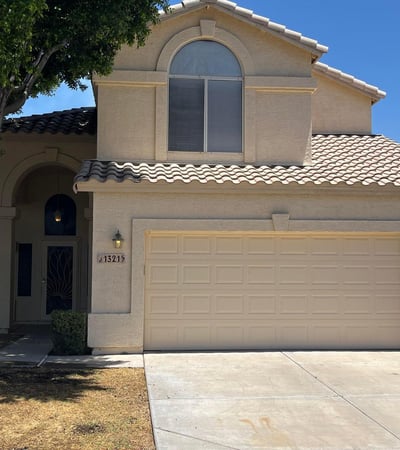 Beautifully maintained exterior with attractive architecture, mature shade trees, a covered front entry, and an attached 2-car garage in the sought-after Val Vista Lakes community in Gilbert.