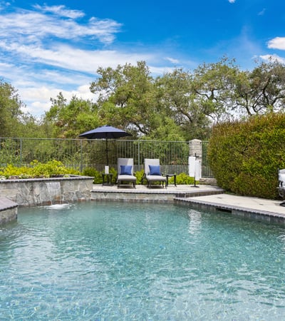 Discover your private oasis with a luxurious pool and tranquil landscaping, perfect for relaxation and entertaining.