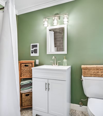 Chic bathroom with calming green hues.