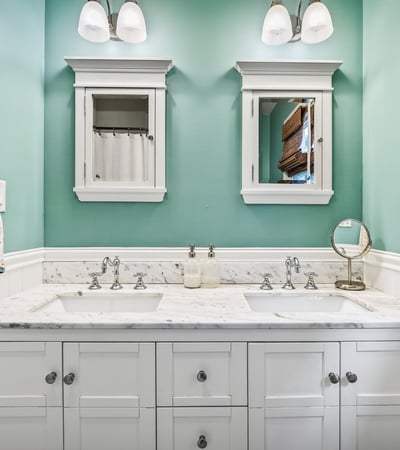 Dual sinks and medicine cabinets.
