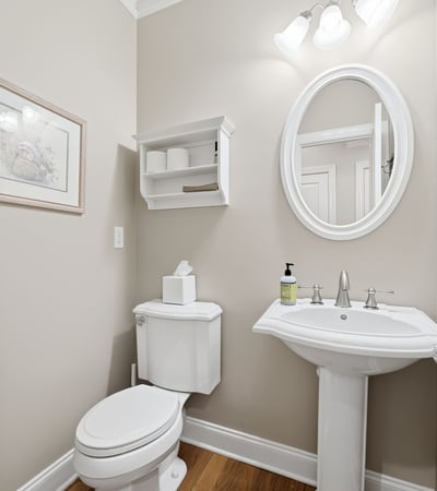 Bright and functional half bath featuring modern fixtures and a clean, inviting atmosphere.