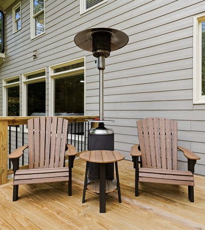 Cozy outdoor space featuring comfortable seating and a patio heater, perfect for year-round relaxation.