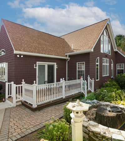 Discover this inviting home with a spacious design, lush gardens, and a refreshing pool area.