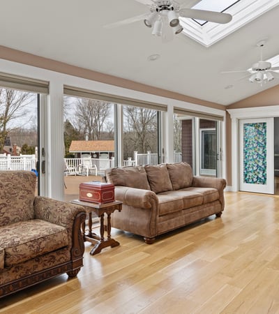 Bright and airy living space featuring large windows, abundant natural light, and direct access to outdoor areas.
