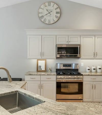 This modern kitchen features sleek cabinetry, high-end appliances, and ample natural light. Ideal for cooking and entertaining.