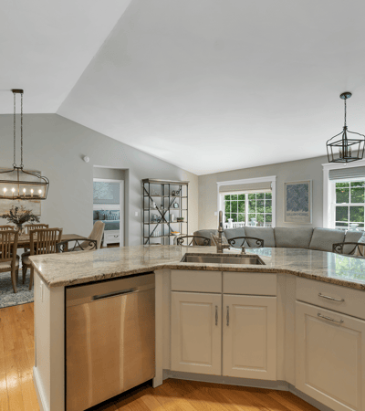 Bright and open living space featuring a modern kitchen seamlessly connected to the inviting dining area.
