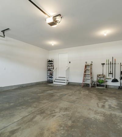 Spacious garage offering ample storage solutions and convenient access to the home’s interior.